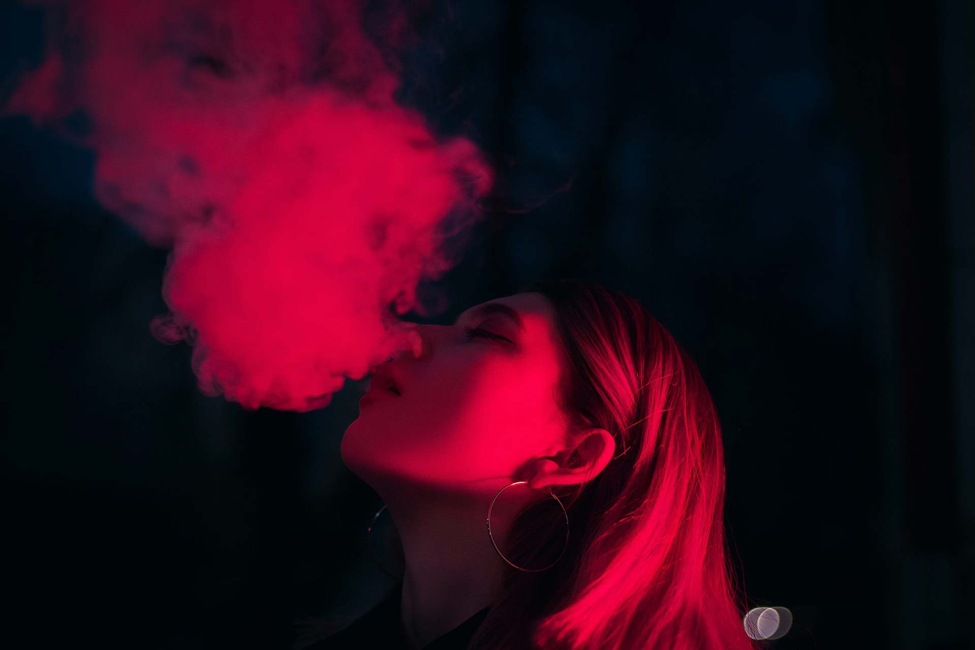 Woman smoking Kushy Dreams Energy Pre-Roll